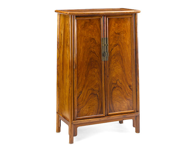 A hardwood rounded-corner tapered cabinet