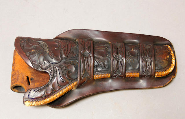 A tooled leather single action holster