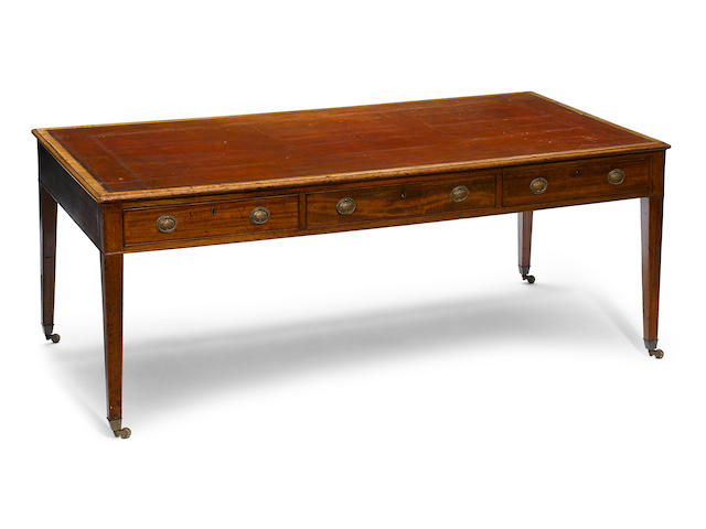 An imposing George III mahogany partners' writing desk