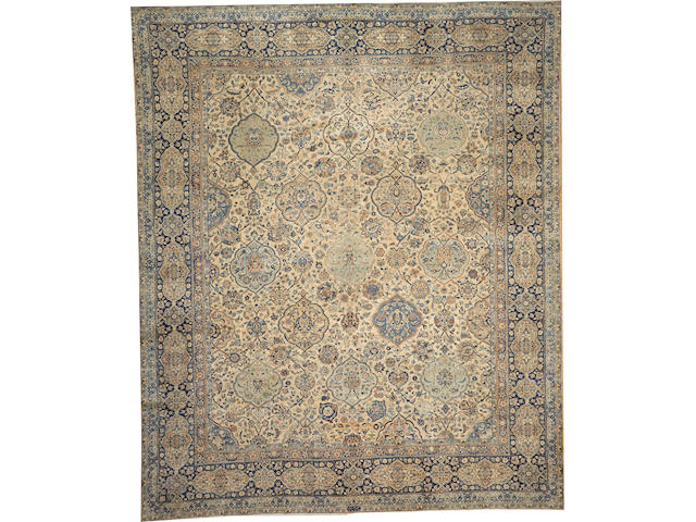 A Kerman carpet  size approximately 12ft. 7in. x 15ft. 3in.