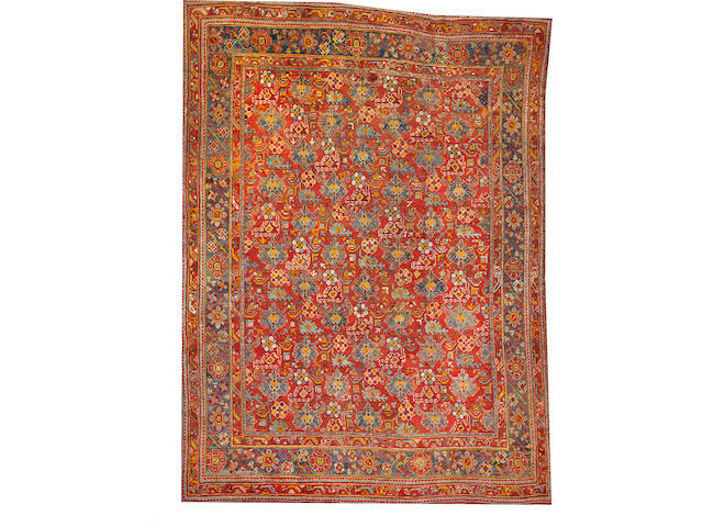 An Oushak carpet  size approximately 10ft. 7in. x 14ft. 8in.