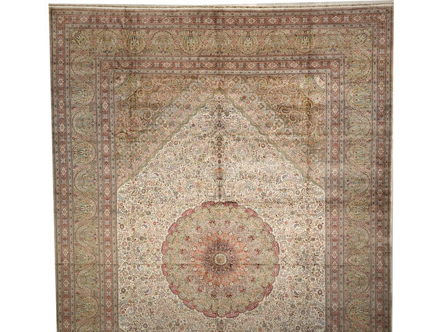 A Chinese silk carpet  size approximately 16ft. x 23ft. 9in.