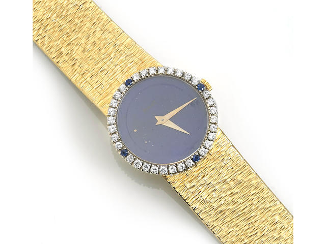A lapis lazuli, sapphire, diamond and eighteen karat gold integral bracelet wristwatch, Piaget