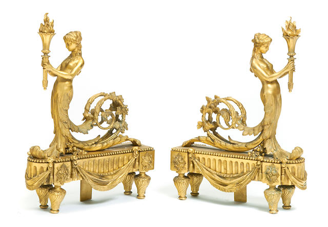 A pair of Louis XVI style gilt bronze chenets late 19th century