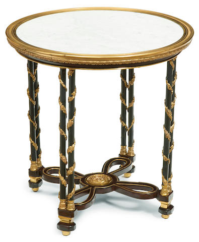 A Louis XVI style gilt and patinated bronze and mahogany occasional table