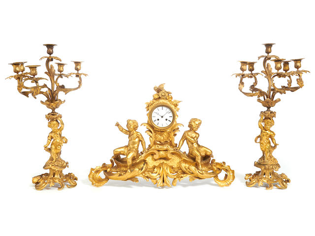 An assembled French gilt bronze clock garniture late 19th century