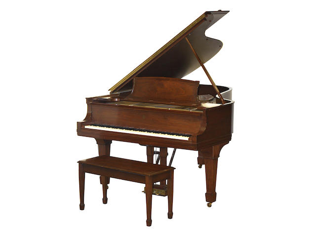 A Steinway & Sons walnut grand piano