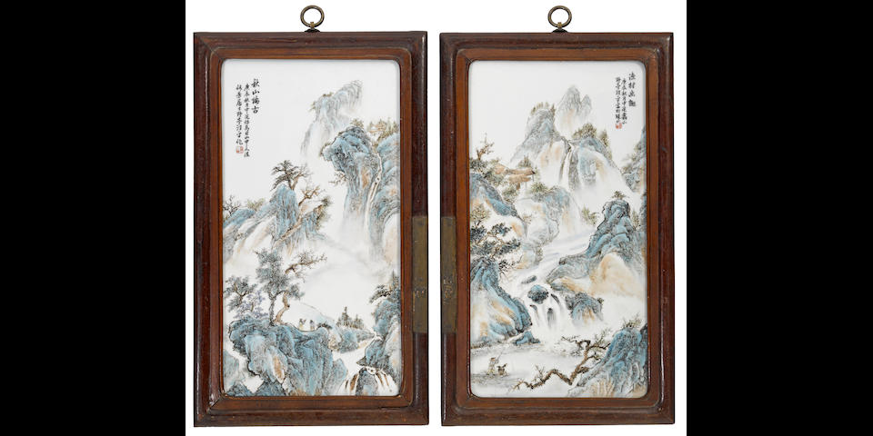 A pair of framed porcelain landscape plaques
