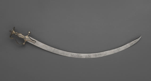 An Indian tulwar with silver and gold damascened hilt
