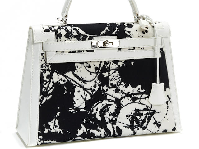 A rare Herm&#232;s special order black and white Kelly handbag
