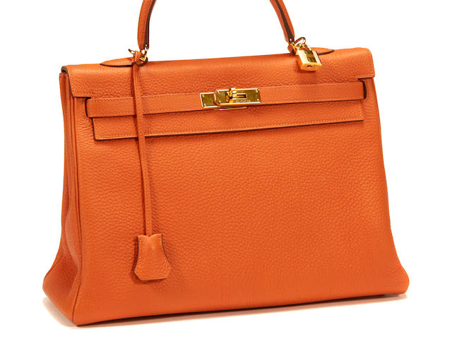 An Herm&#232;s orange leather Kelly handbag