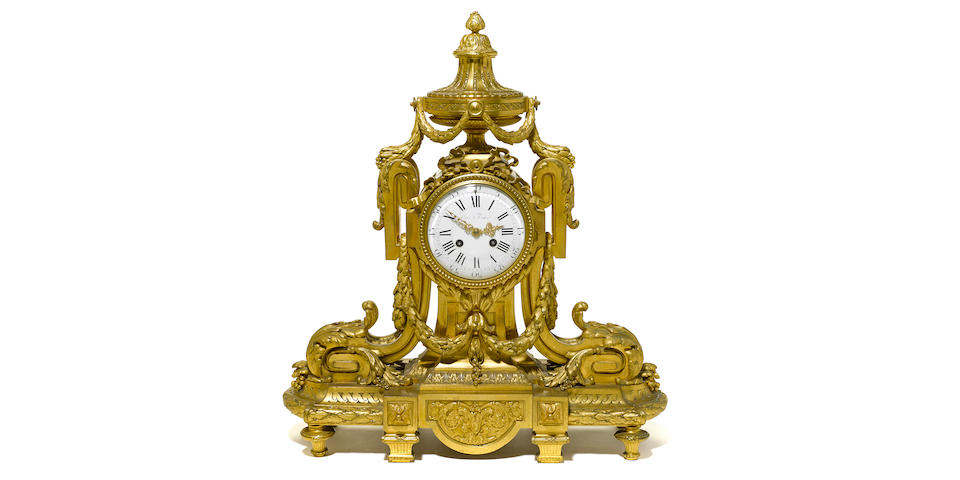 A Louis XVI style gilt bronze mantel clock