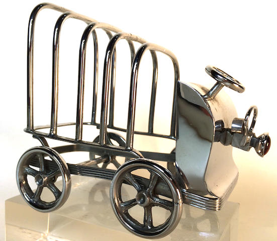 A Sheffield toaster rack in the shape of a car, England, circa 1900,