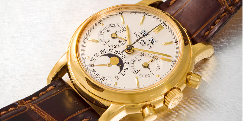 Patek Philippe. A fine 18K gold chronograph wristwatch with perpetual calendar and moon phaseRef:3970E, Movement No. 3046987, Case No. 4225171, Manufactured in 2001