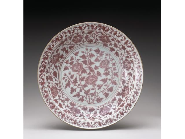 A rare and important underglaze copper red decorated dish