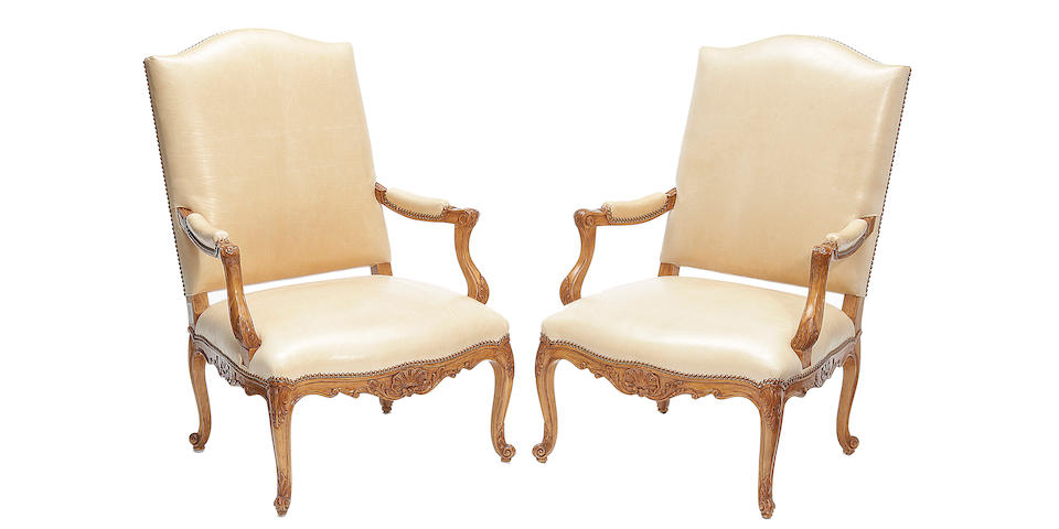 A pair of Rose Tarlow Louis XV style leather upholstered armchairs