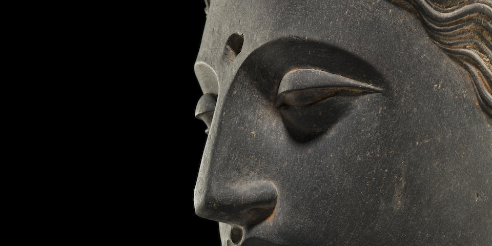 A carved schist head of Buddha Ancient region of Gandhara, 3rd/4th century