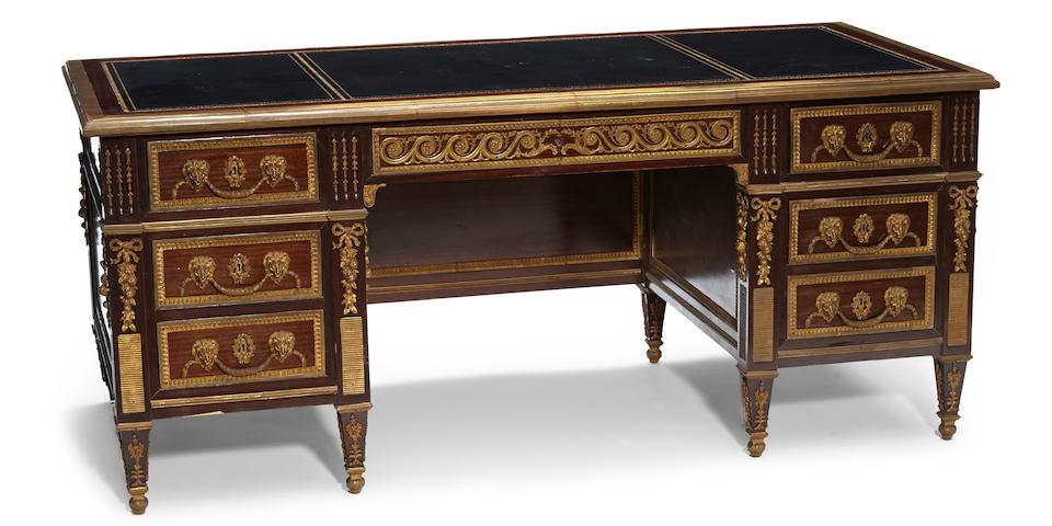 A Louis XVI style gilt bronze mounted mahogany bureau plat