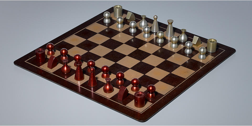 Man Ray Chess Setdesigned circa 1945, this example executed 1947, comprising 32 chess pieces, and chess board, anodized aluminum, Bakelite board, chess board engraved 'Man Ray 1947'heights 1 3/8in (3.4cm) to 2in (5.1cm); chess board 18in x 18in (45.7cm) x (45.7cm)