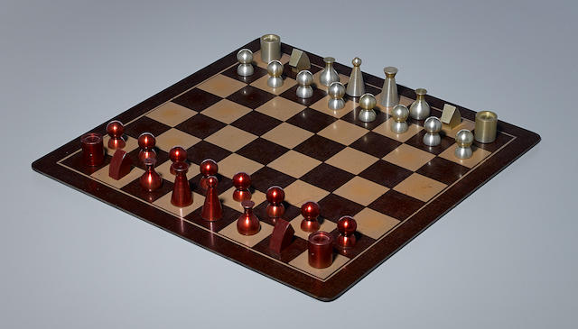 Man Ray Chess Setdesigned circa 1945, this example executed 1947, comprising 32 chess pieces, and chess board, anodized aluminum, Bakelite board, chess board engraved 'Man Ray 1947'heights 1 3/8in (3.4cm) to 2in (5.1cm); chess board 18in x 18in (45.7cm) x (45.7cm)