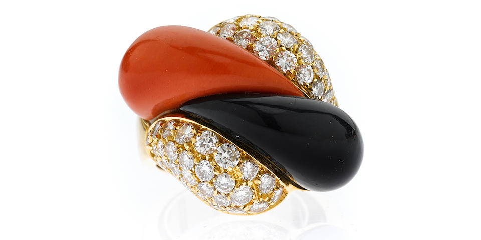 A coral, diamond and onyx ring