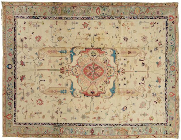 A Turkish carpet  size approximately 9ft. 11in. x 12ft. 7in.