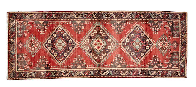 A Northwest Persian runner  size approximately 3ft. 11in. x 10ft. 8in.