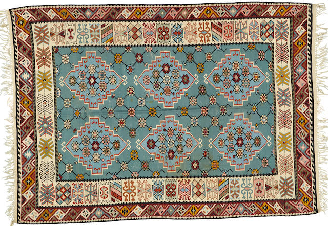 A Turkish kilim size approximately 6ft. 8in. x 9ft. 5in.