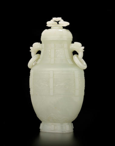 A fine very pale green jade archaistic vase and cover  Qianlong period