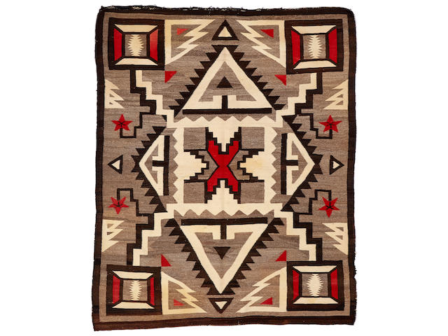 A Navajo rug size approximately 5ft. 4in. x 6ft. 8in.