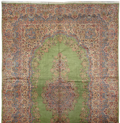 A Kerman carpet size approximately 13ft. 8in. x 21ft. 5in. image 1
