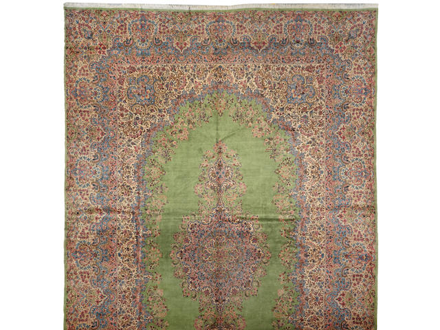 A Kerman carpet size approximately 13ft. 8in. x 21ft. 5in.
