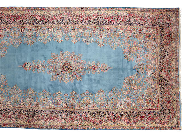 A Kerman carpet  size approximately 11ft. 2in. x 21ft. 6in.