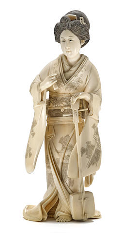 An ivory okimono of a geisha Meiji era, late 19th century