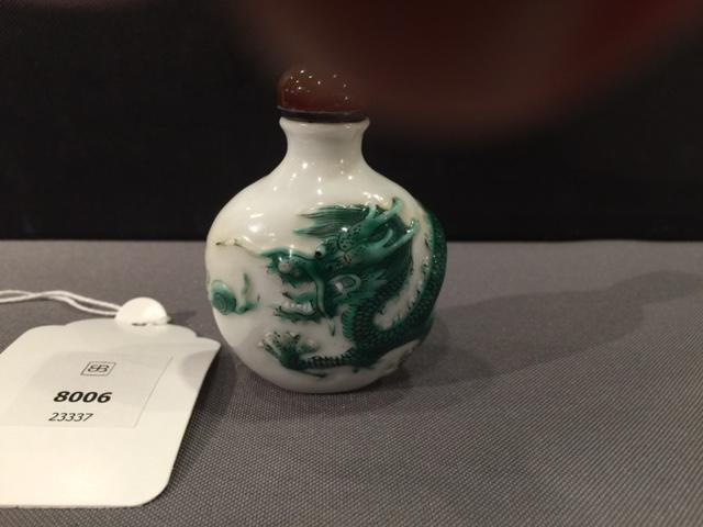 A molded green-enameled 'dragon' snuff bottle Daoguang seal mark and of the period, Imperial kilns, Jingdezhen