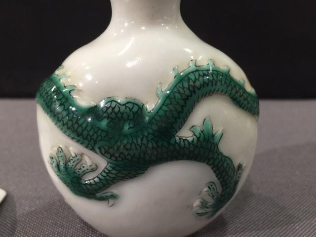 A molded green-enameled 'dragon' snuff bottle Daoguang seal mark and of the period, Imperial kilns, Jingdezhen