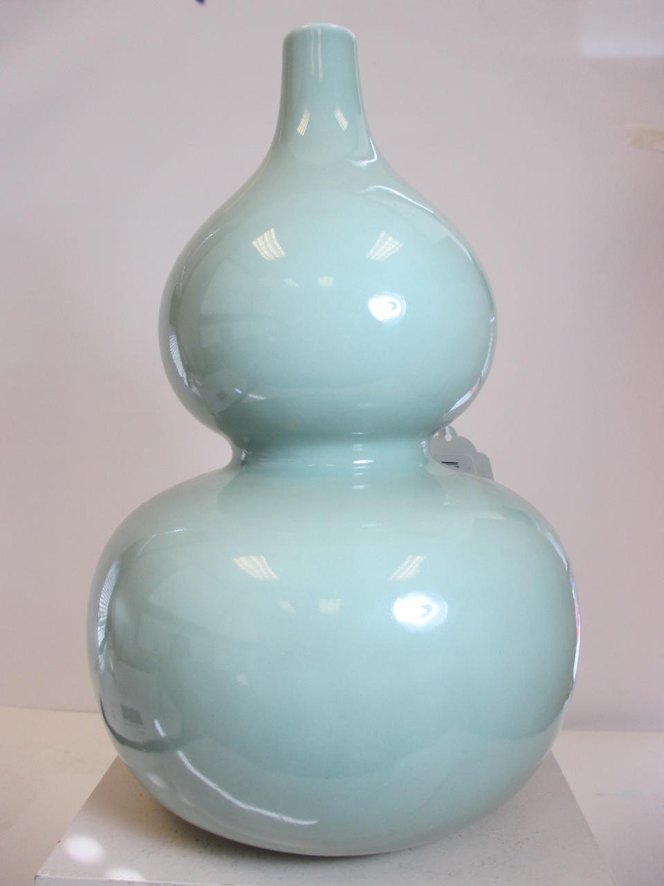A celadon glazed double gourd vase Qianlong mark