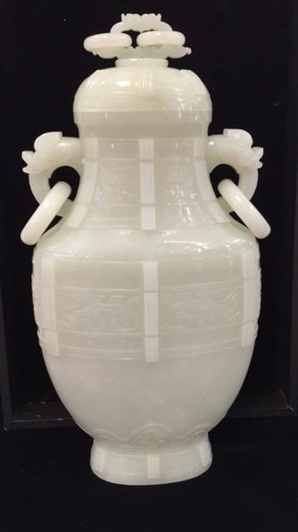 A fine very pale green jade archaistic vase and cover  Qianlong period