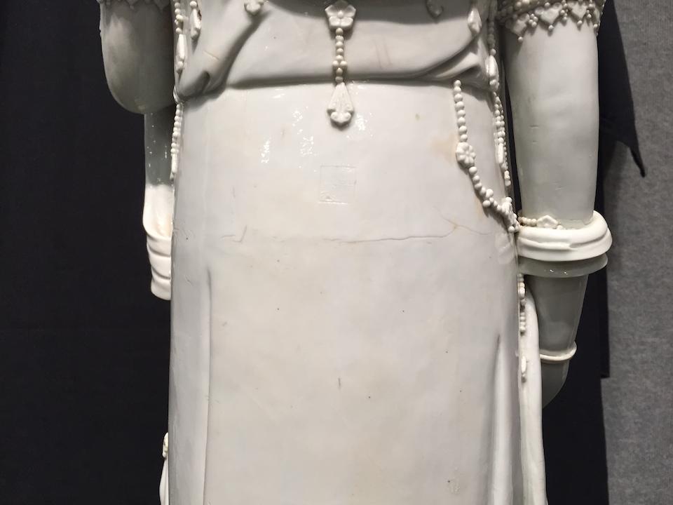 A large blanc de chine figure of Guanyin 19th/early 20th century, two Xu Yunlin seal marks and one Dehua seal mark