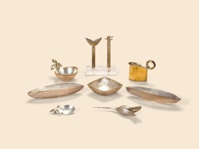 Modern Craft Group of sterling silver articles, late 20th/early 21st centuriescomprising a Jack da Silva 18kt gold washed sterling creamer, 2003, a Mexican silver sugar bowl & scoop, a silver Duck spoon, two leaf form dishes, a Barbara Bayre square dish, a tree-form salt and pepper on acrylic stand, signed Spring Buties 925, together with a mixed metal and 'jeweled' magnifying glass and letter openerheight of creamer 3 1/4in (8cm); length of dishes 4in (10cm) to 7 1/2in (19cm)