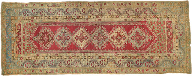 A Ghiordes runner West Anatolia size approximately 5ft. 6in. x 13ft. 10in.