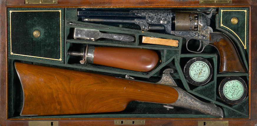 An engraved Colt Model 1851 Navy percussion revolver with shoulder stock in deluxe casing image 1