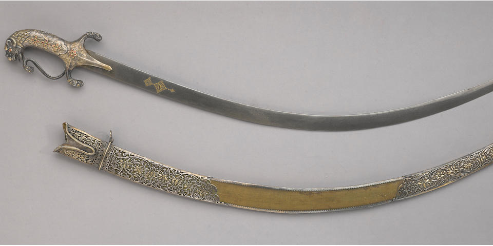 A fine gem-set and parcel-gilt silver hilted Indian saber