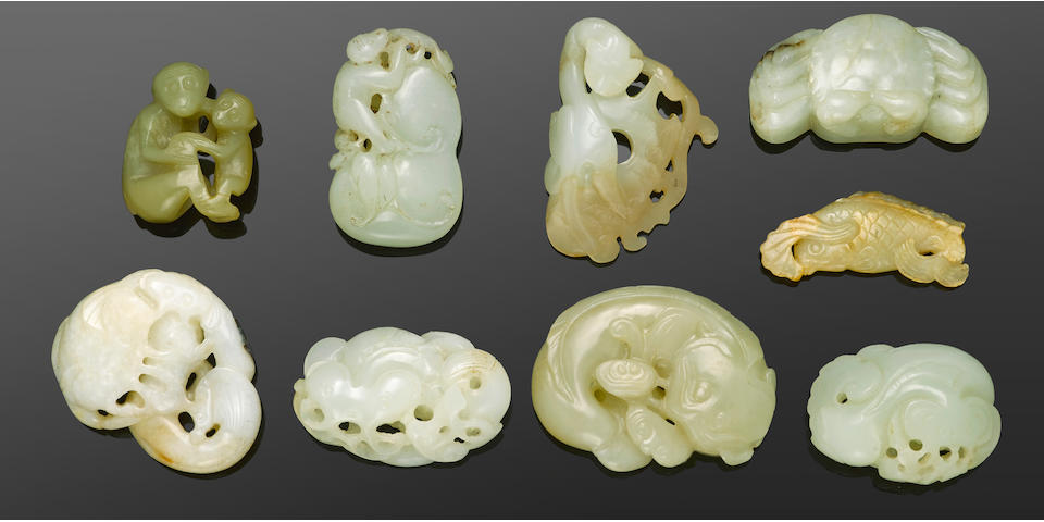 A group of nine reticulated jade animal carvings