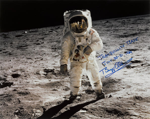 APOLLO 11 AT TRANQUILLITY BASE, JULY 20 - 21, 1969 ALDRIN INSCRIBES AND SIGNS HISTORY'S BEST KNOWN LUNAR PHOTOGRAPH Large color photograph, 16 x 20 inches.