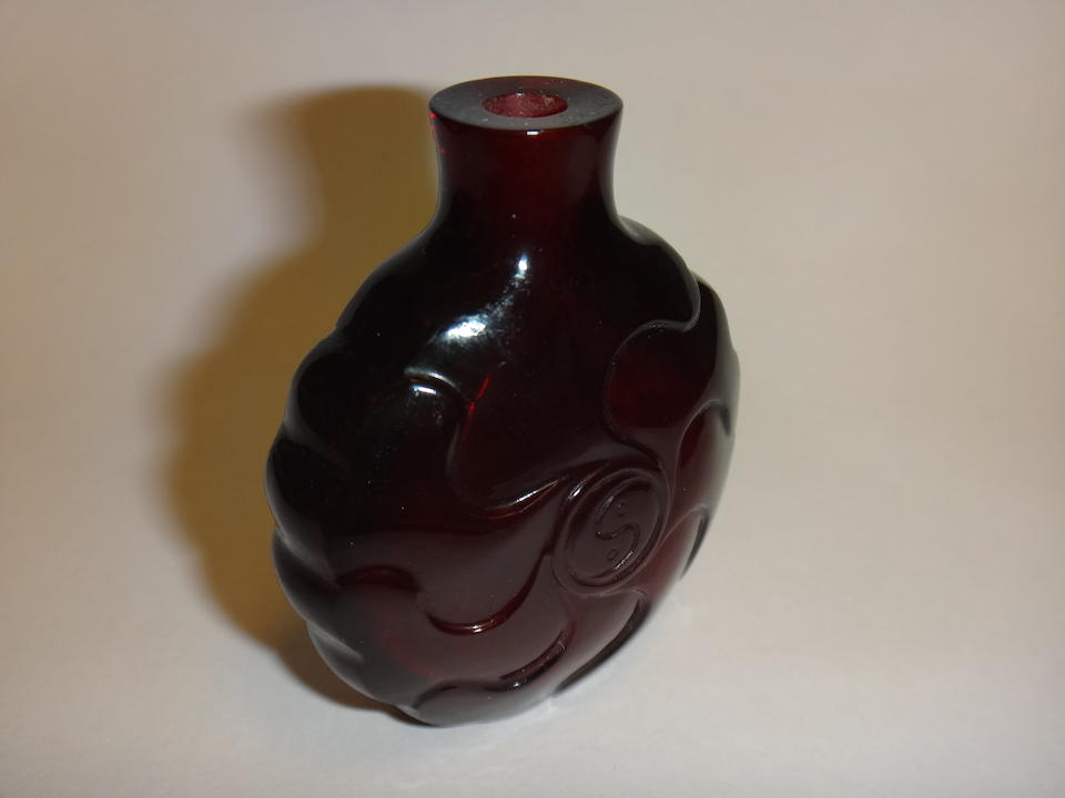 A ruby glass 'mallow flower' snuff bottle 1750-1820