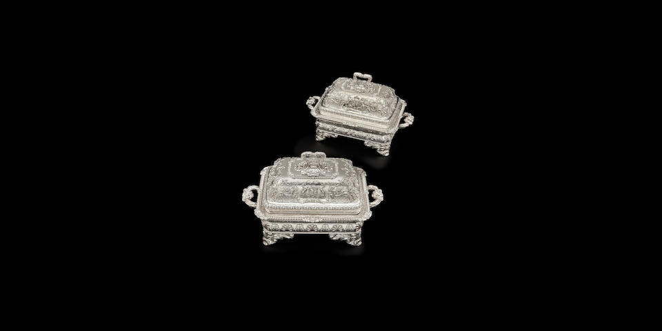A pair of Important Regency sterling silver covered entr&#233;e dishes on Sheffield plated stands from the Duke of Norfolk Service the covers and dishes by Paul Storr, London, 1816-17; stands marked for Matthew Boulton, Birmingham