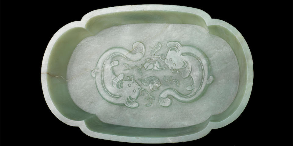 A mottled green and white jadeite quatrelobed bowl Late Qing/Republic period