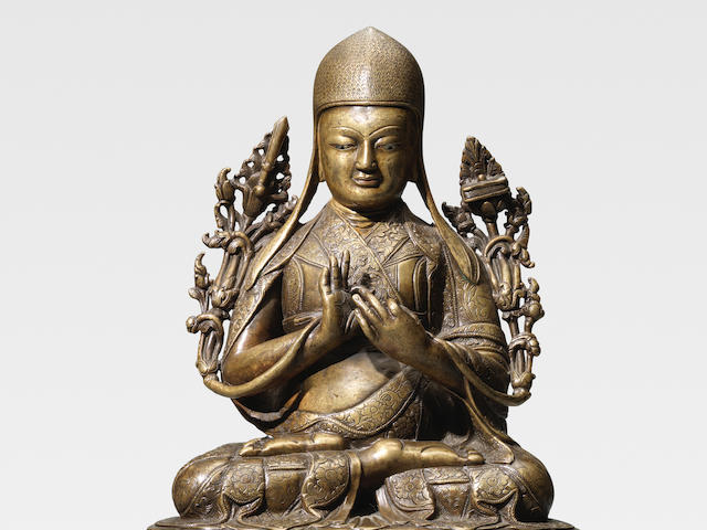 A SILVER INLAID COPPER ALLOY FIGURE OF SANGGYE PEL TSANG, CENTRAL TIBET, 15TH CENTURY