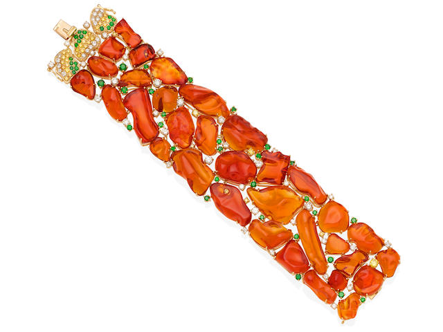 A fire opal, diamond, colored diamond, demantoid garnet and gold bracelet
